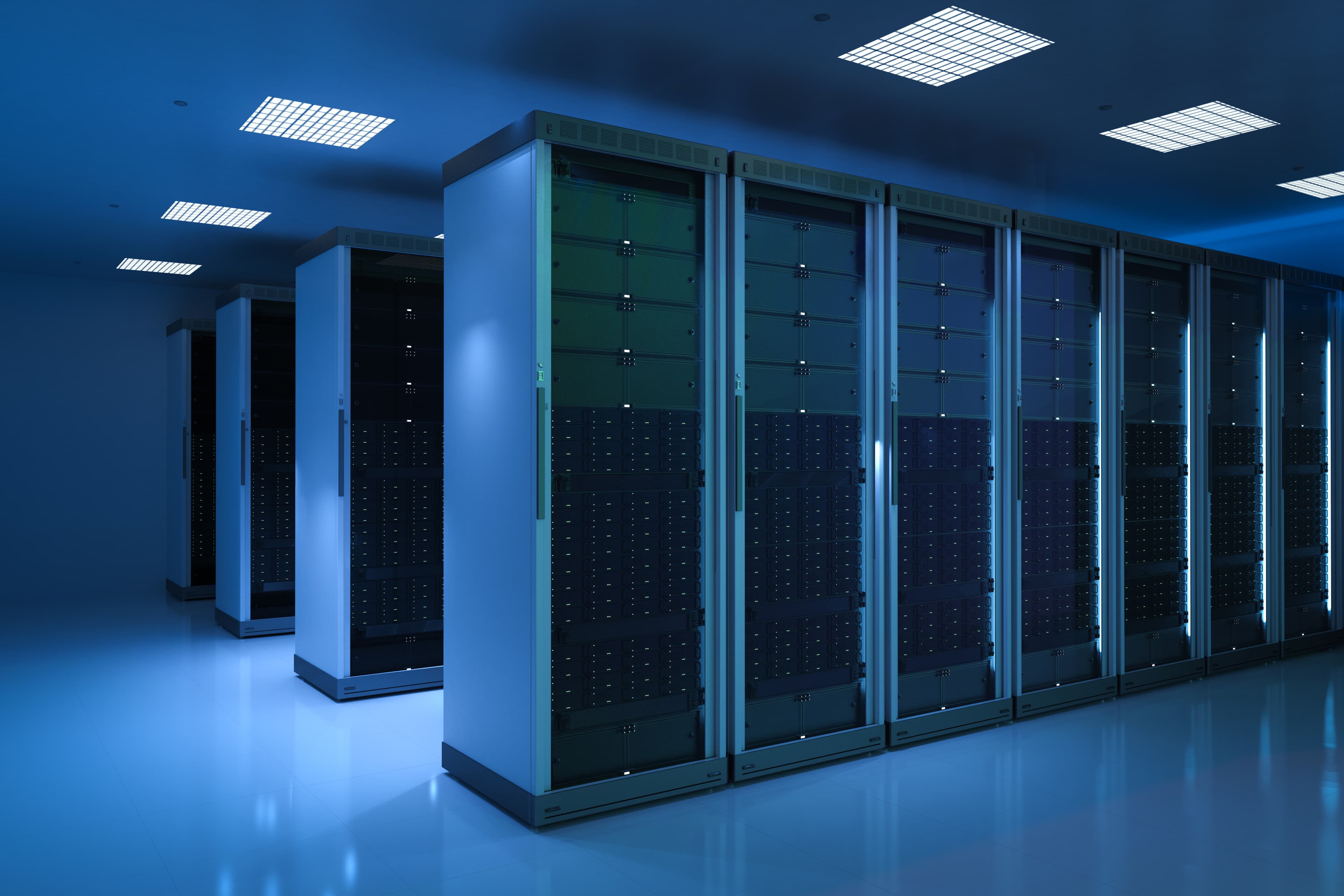 Data center racks under a blue light